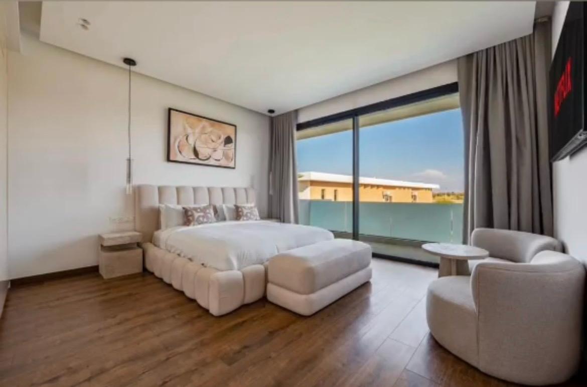 Master bedroom suite with terrace and pool views at The Royal VVIP
