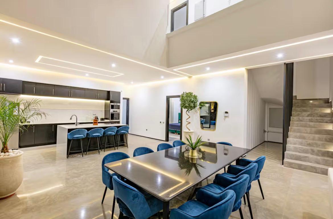 Designer open-plan kitchen with island seating at The Palm