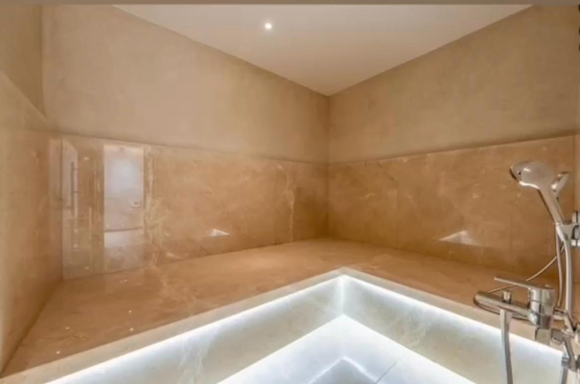 Marble hammam with backlit plunge area at The Royal VVIP